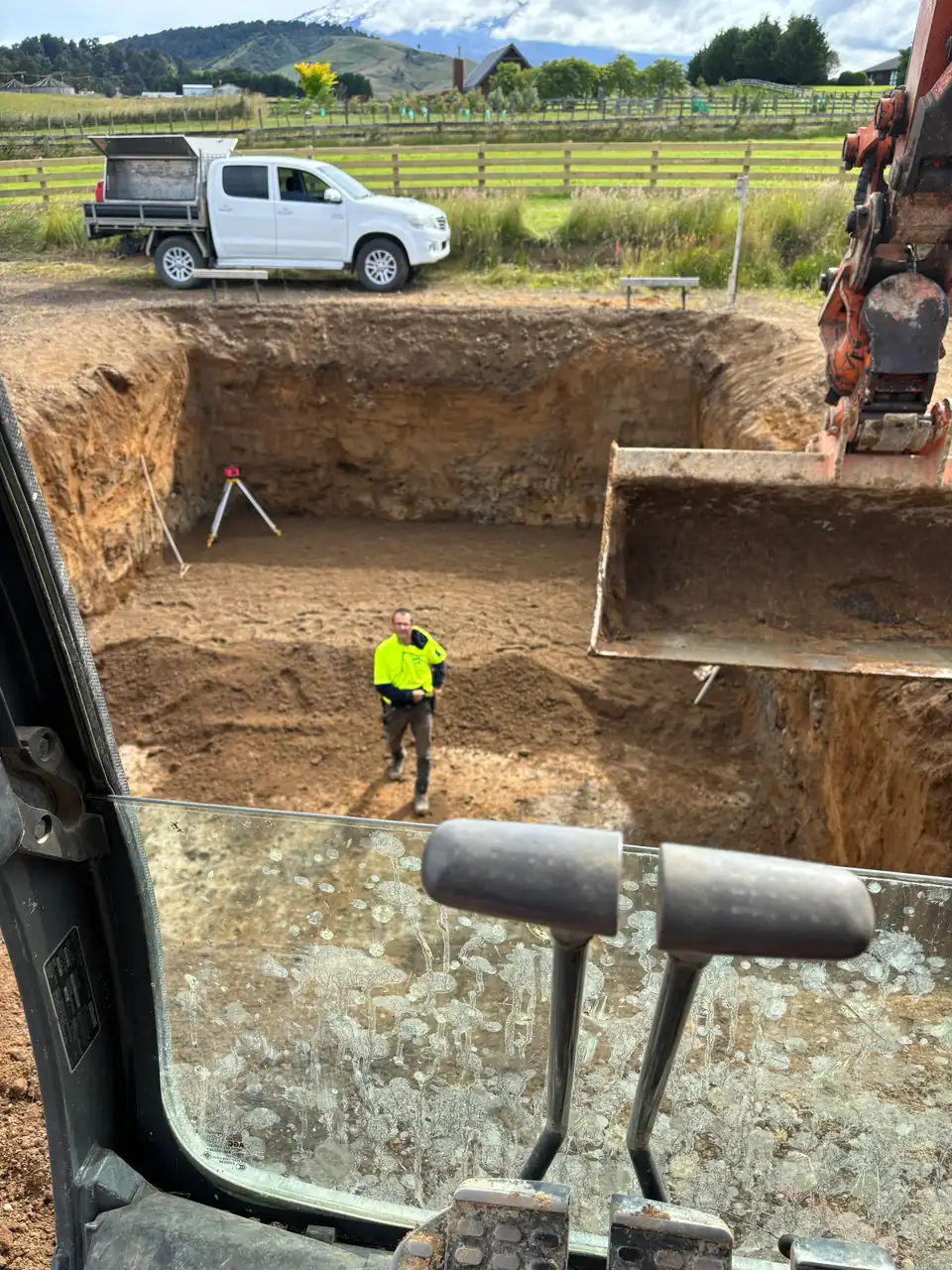 House foundation excavation seen from the excavator cab